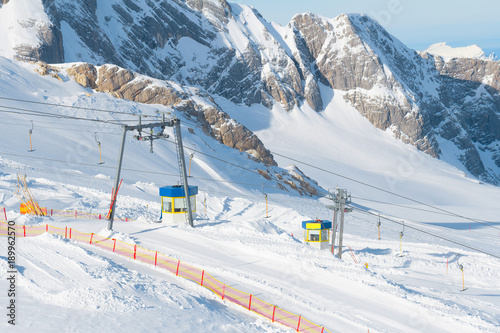 winter mountains panorama with ski slopes and ski lifts