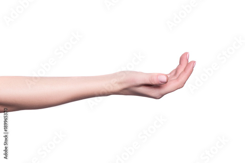 Empty open woman palm holding a gift box or showing a beauty product or other objects isolated on white background