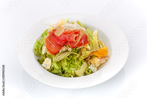 Restaurant food. Salad with bread in a plate. Delicious food.