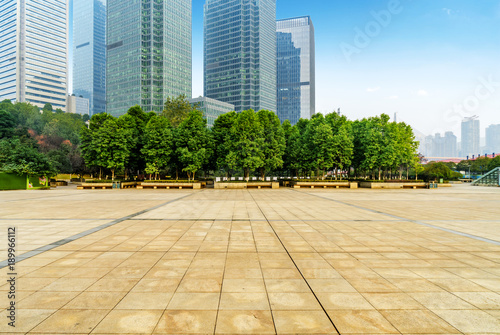 Panoramic skyline and buildings with empty concrete square floor