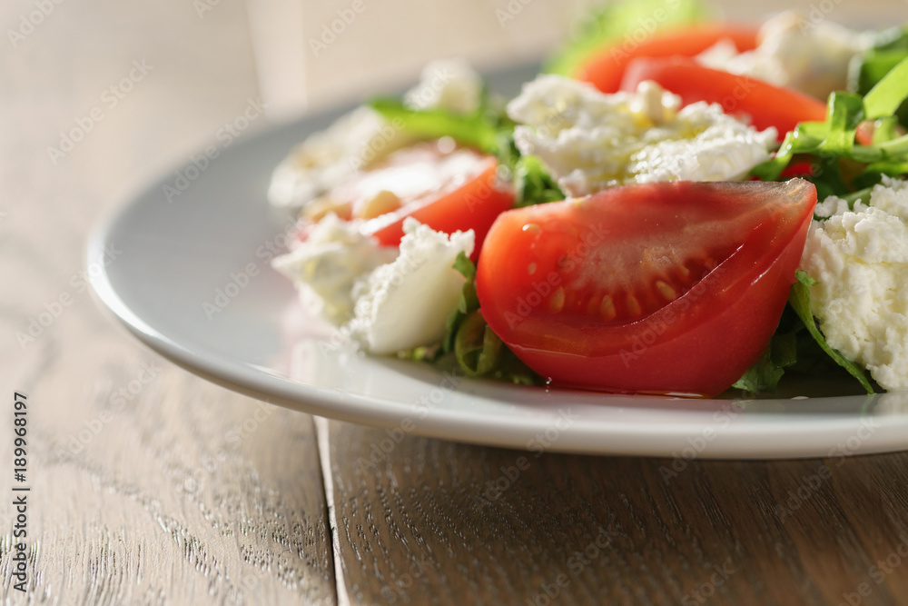 Fresh summer salad with tomatoes, arugula and mozzarella Fresh summer salad with tomatoes, arugula and mozzarella