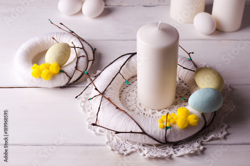 Canvas Print easter decor home - light decor, wreaths, candles and nest with white easter egg