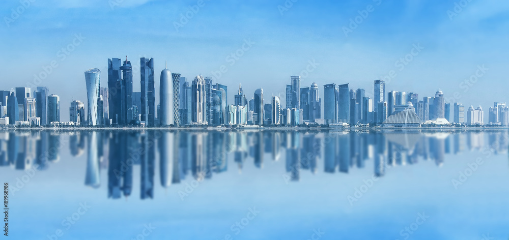 Futuristic urban skyline of Doha, Qatar. Doha is the capital and largest city of the Arab state of Qatar. Panoramic landscape of West bay