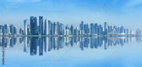 Futuristic urban skyline of Doha, Qatar. Doha is the capital and largest city of the Arab state of Qatar. Panoramic landscape of West bay © zenobillis
