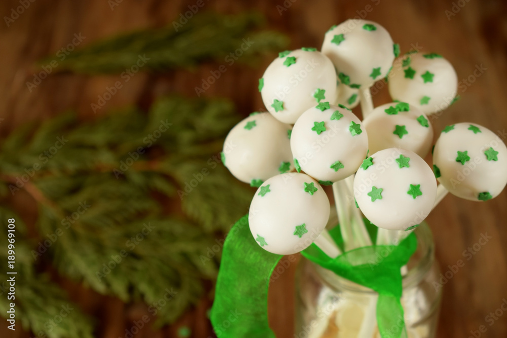 White chocolate cake pops with green stars