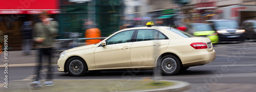 Fotografie, Obraz german taxi cab speeding in the city