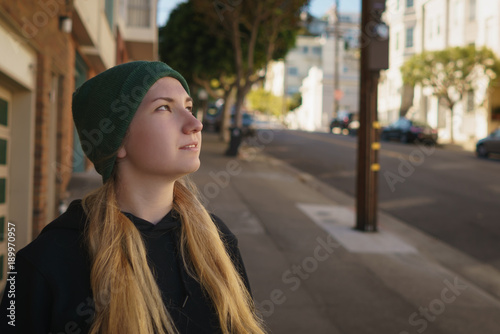 Portrait of teen girl on Lombard street in autumn day
