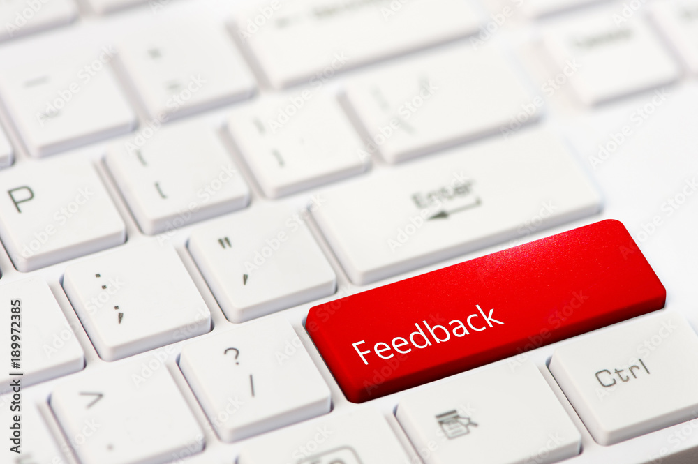 red key with text feedback on white laptop keyboard red key with text feedback on white laptop keyboard