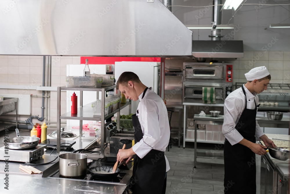 Restaurant cook lifestyle. Daily routine of chef working in a kitchen.