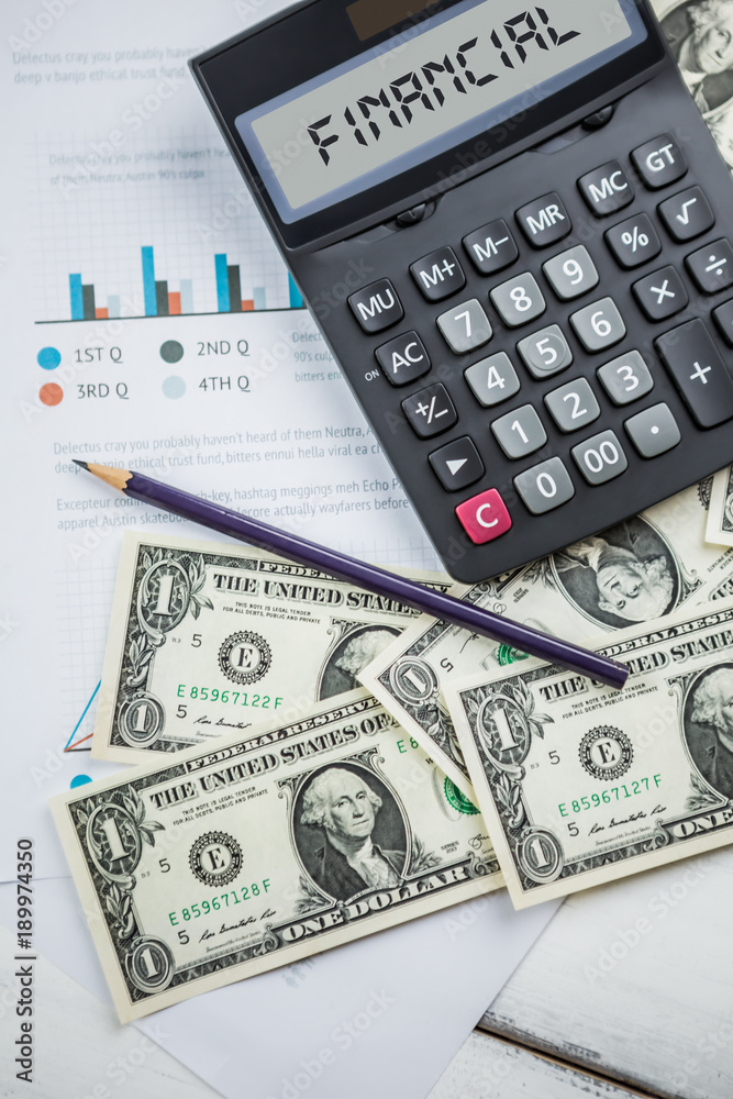 Calculator with american dollars on the wooden table background, finance concept Calculator with american dollars on the wooden table background, finance concept