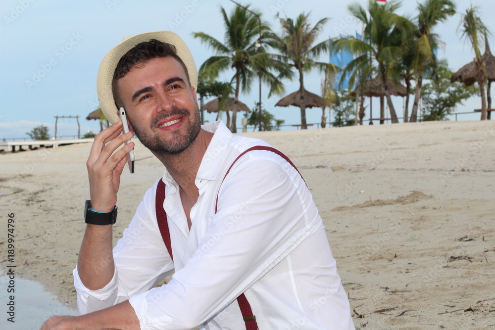 Man making a call from the beach Man making a call from the beach