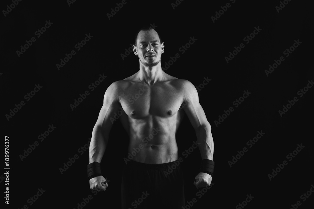Naklejka premium Strong athletic man showes naked muscular body