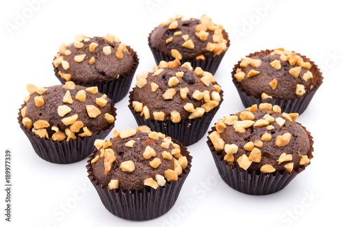 Group of chocolate muffins with nuts crumbs isolated on white background
