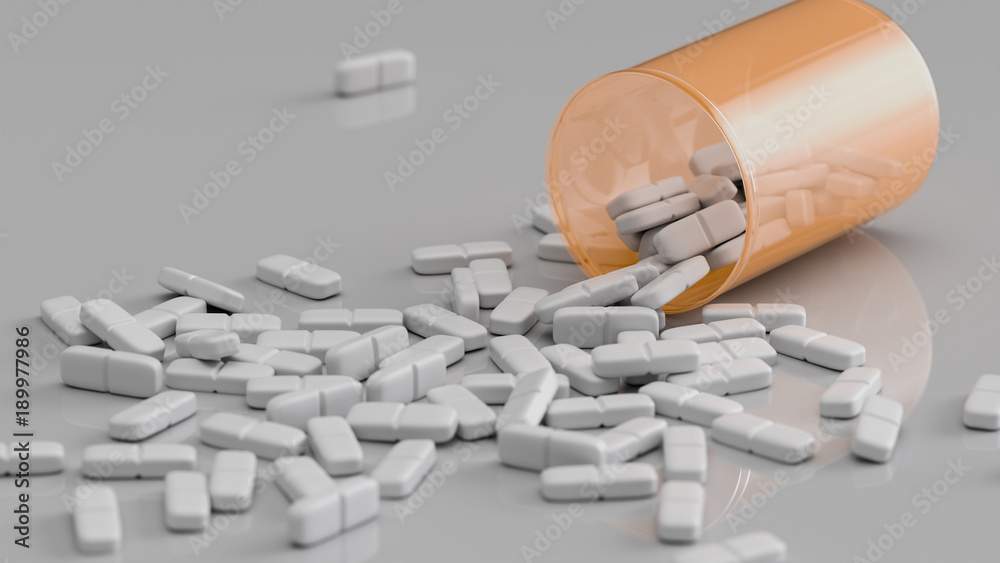 Weiße Tabletten liegen verteilt auf einem Tisch Weiße Tabletten liegen verteilt auf einem Tisch