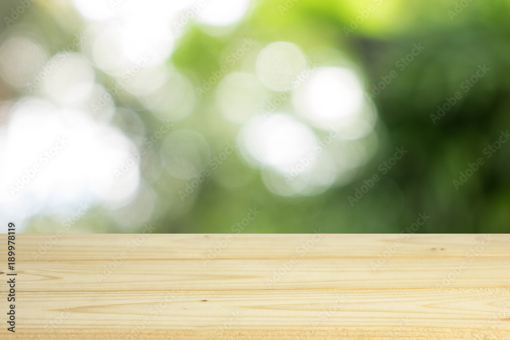 wood shelf on blurred green leaves background wood shelf on blurred green leaves background