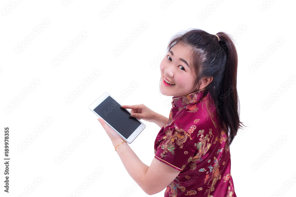 Beautiful Young asian woman wear chinese dress traditional cheongsam or qipao. Hand holding blank screen digital tablet. isolated on white background, Concept buying digital online, technology. Beautiful Young asian woman wear chinese dress traditional cheongsam or qipao. Hand holding blank screen digital tablet. isolated on white background, Concept buying digital online, technology.