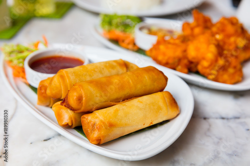 Photography Spring Rolls And Fried Chicken Served In Plates