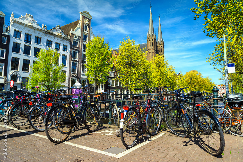 Spectacular cityscape with traditional Dutch buildings and bicycles, Amsterdam, Netherlands