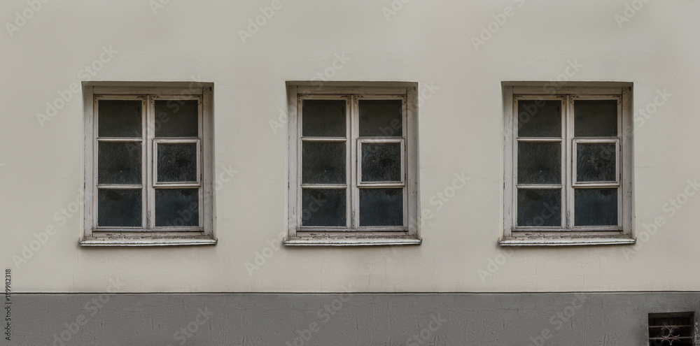 Old European classic building three windows facade