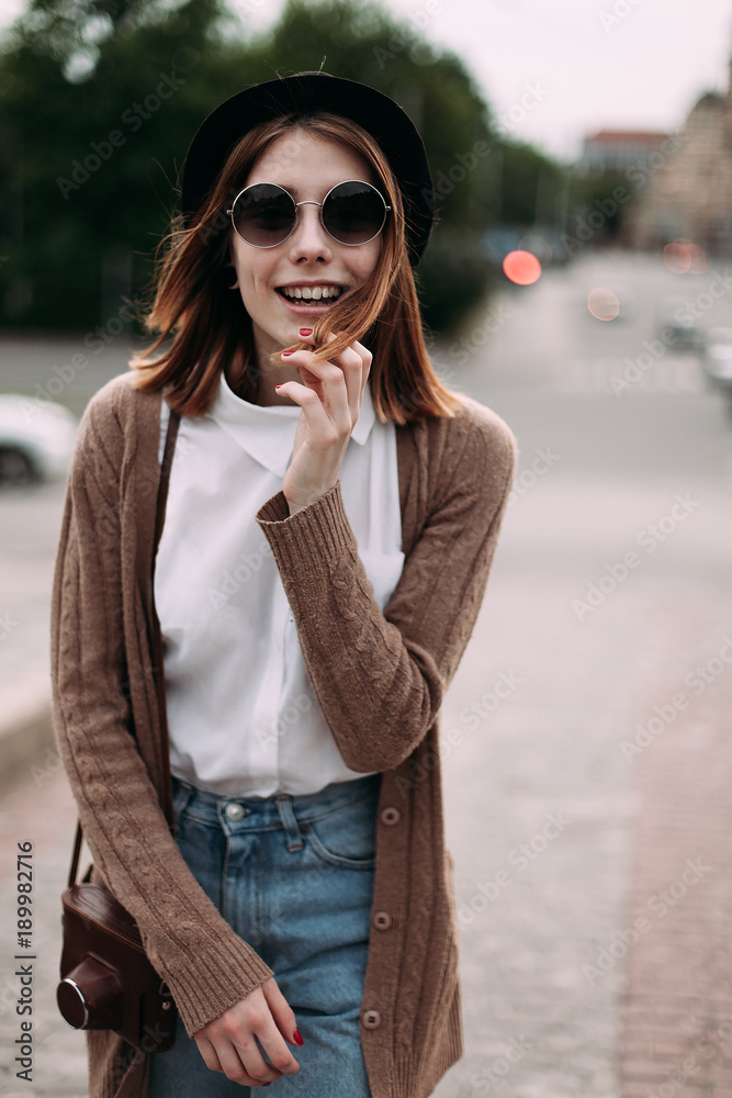 Beautiful girl walking and smiling in the city Beautiful girl walking and smiling in the city