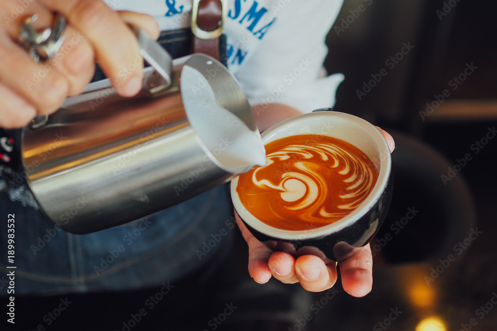 barista make coffee latte art with coffee espresso machine in coffee shop  cafe in vintage color tone Stock Photo | Adobe Stock