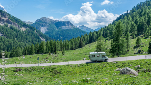 mountain landscape in summer and the dark blue sky with clouds in Trentino Alto Adige. View from Passo Rolle, Italian Dolomites, Trento, Italy.