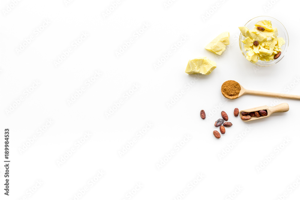 Cocoa butter for skin care. White background top view copy space Cocoa butter for skin care. White background top view copy space