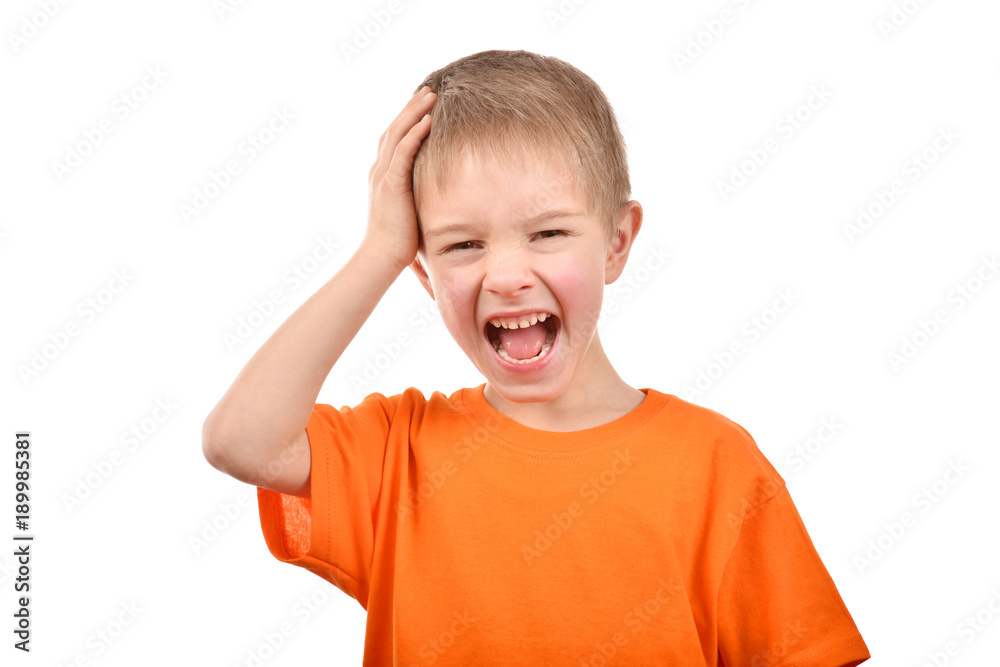 Emotional portrait of a teenager. A boy in an orange t-shirt. Beautiful and happy child isolated on a white background. Emotional portrait of a teenager. A boy in an orange t-shirt. Beautiful and happy child isolated on a white background.
