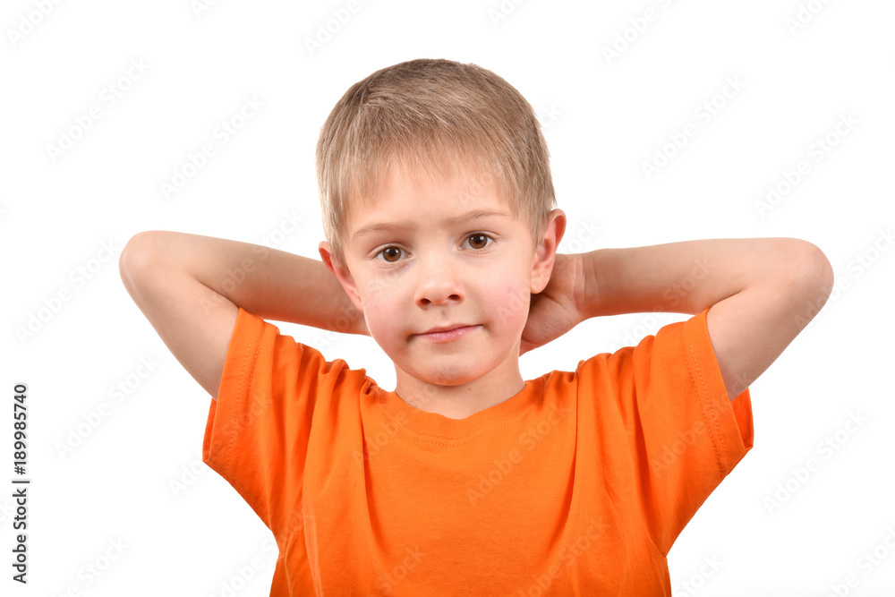Emotional portrait of a teenager. A boy in an orange t-shirt. Beautiful and happy child isolated on a white background. Emotional portrait of a teenager. A boy in an orange t-shirt. Beautiful and happy child isolated on a white background.