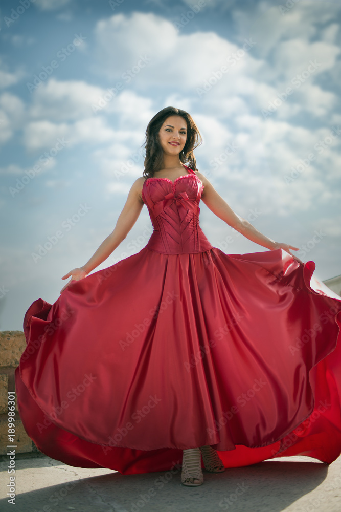 Beautiful woman in a red dress