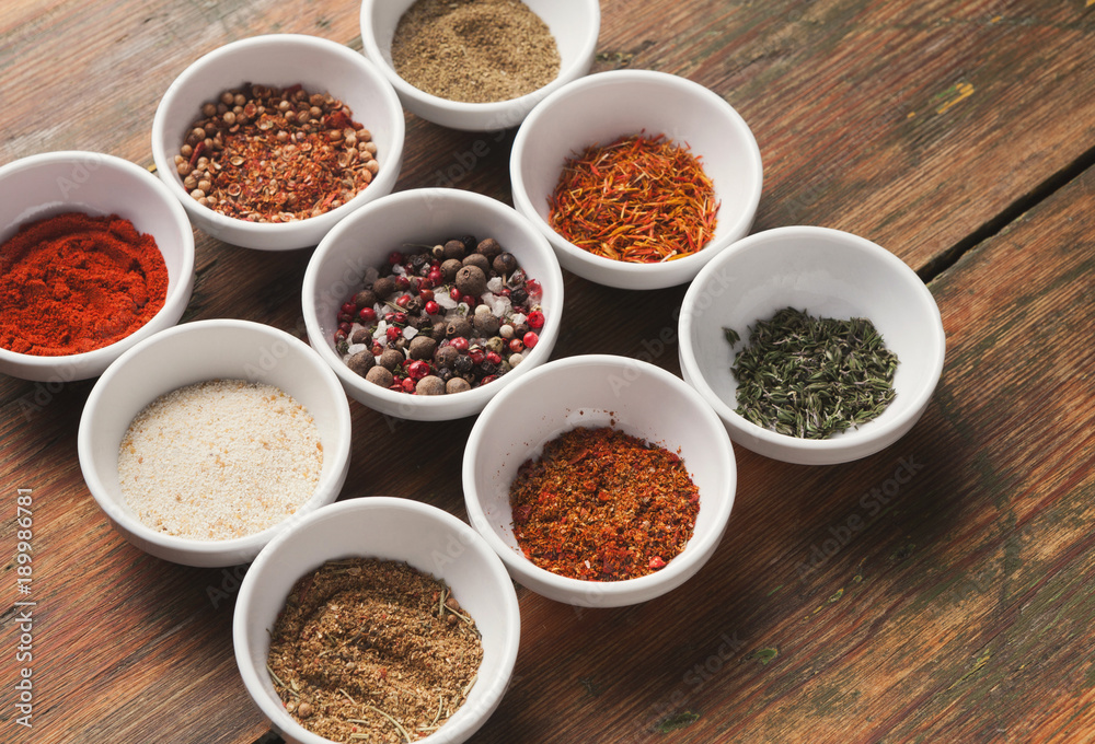 Diverse spices in small cups Diverse spices in small cups