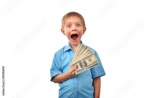 The boy is a businessman. A man holds dollars. The boy has money in his hand. Good profit. The offer for a child. The pocket expenses.