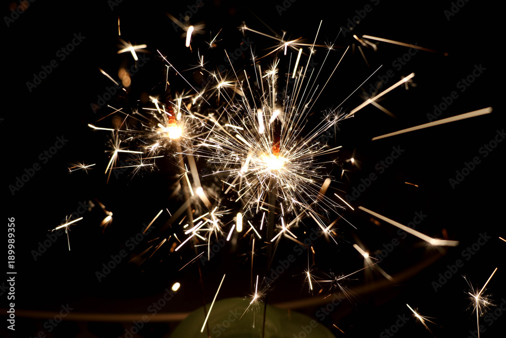 Fototapeta premium sparkler in a dark room