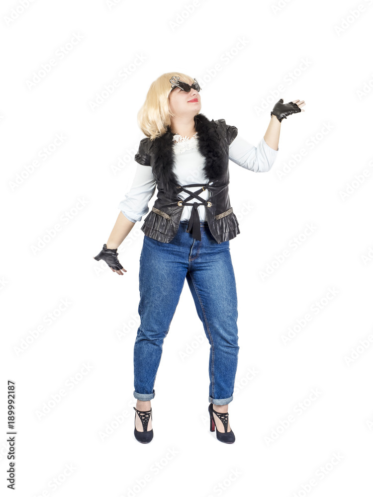 Happy plus size model in daring rockstar style clothes dancing, full length portrait Happy plus size model in daring rockstar style clothes dancing, full length portrait