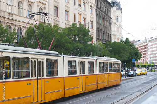 Tram riding in the street, European city