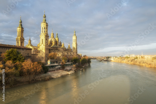 Panoramic view of the Cathedral-Basilica of Our Lady of the Pillar in Zaragoza on the Ebro River during the sunrise, Spain.