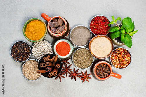 Various oriental spices on the gray textured table