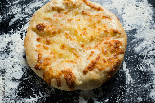 imeretian khachapuri is national Georgian cuisine dish. Baked bread with cheese filling. Delicious pastry snack photo