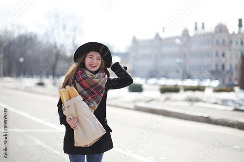 French woman with baguettes in the bag 