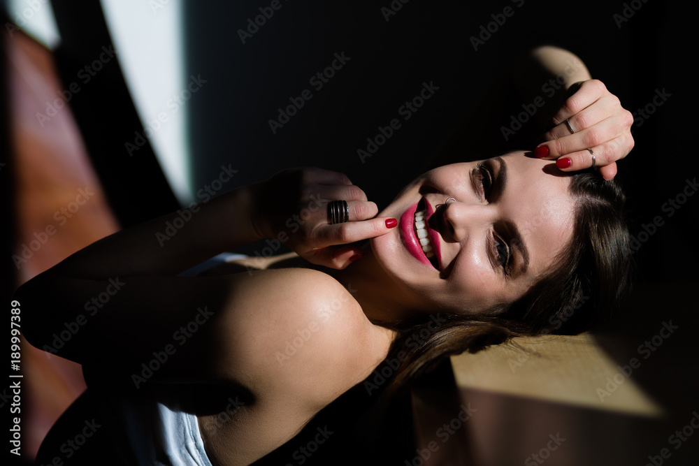 Beautiful young woman posing in natural lighting Beautiful young woman posing in natural lighting