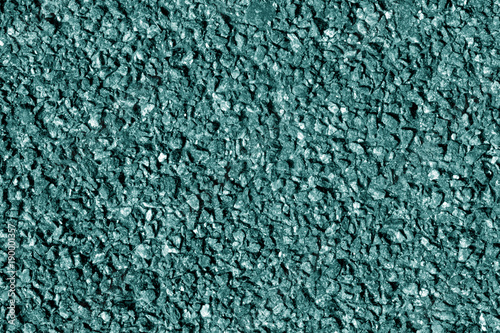 Asphalt texture in cyan tone.