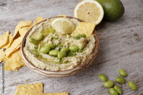 




Hummus with avocado and beans edamame.  Сrisps from corn tortillas. photo