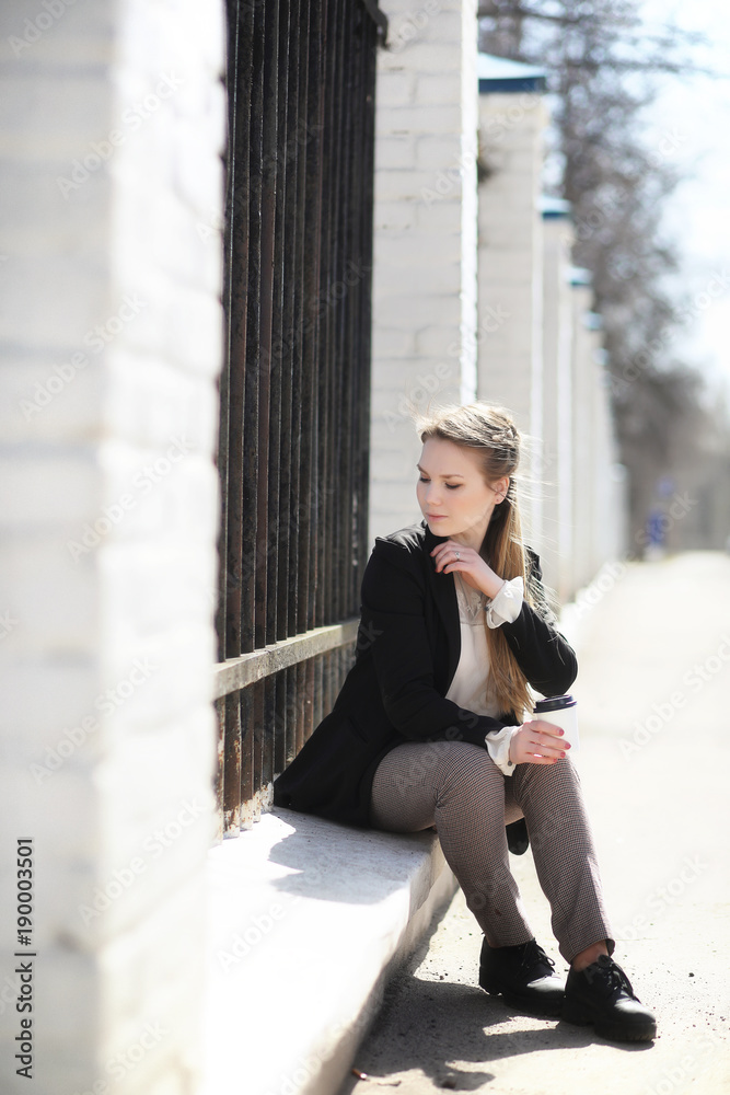 Fototapeta premium Cute girl in an autumn park