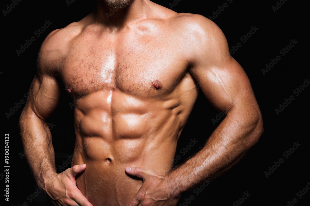 Muscular and sexy torso of young man with perfect abs. Muscular and sexy torso of young man with perfect abs.
