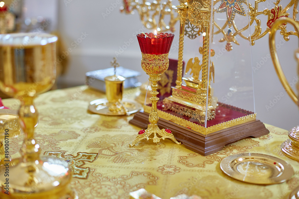 Fototapeta premium Golden religious utensils. Details in the Orthodox Christian Church. Russia.