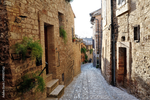 Traditional italian medieval alley in the historic center of beautiful little town of Spello, Perugia , in Umbria region - central Italy