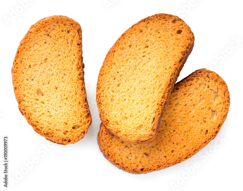 Photos Crispy rusks isolated on white background, close up, top view.