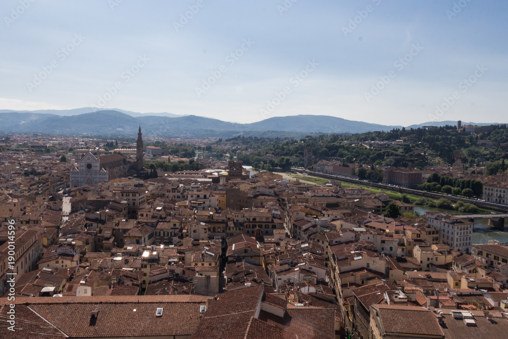Florentine cityscape with red roofs in a sunny day, Tuscany, Italy.