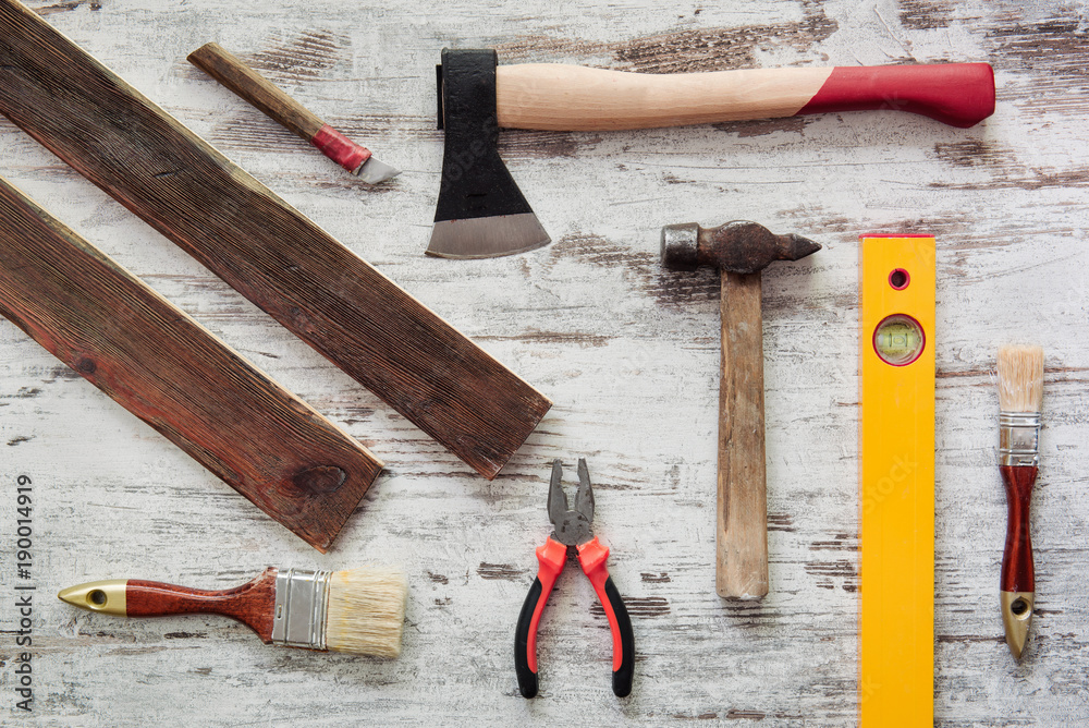 Tools for repairing on grey wooden background