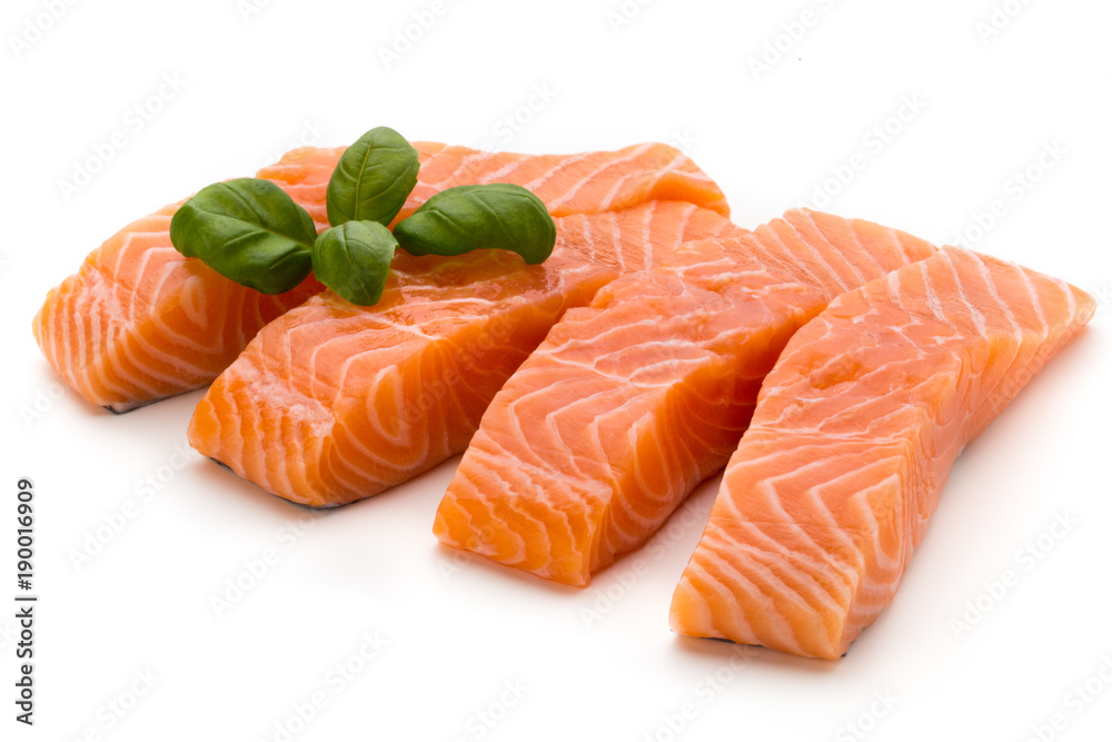Fresh salmon fillet with basil on the white background. Fresh salmon fillet with basil on the white background.